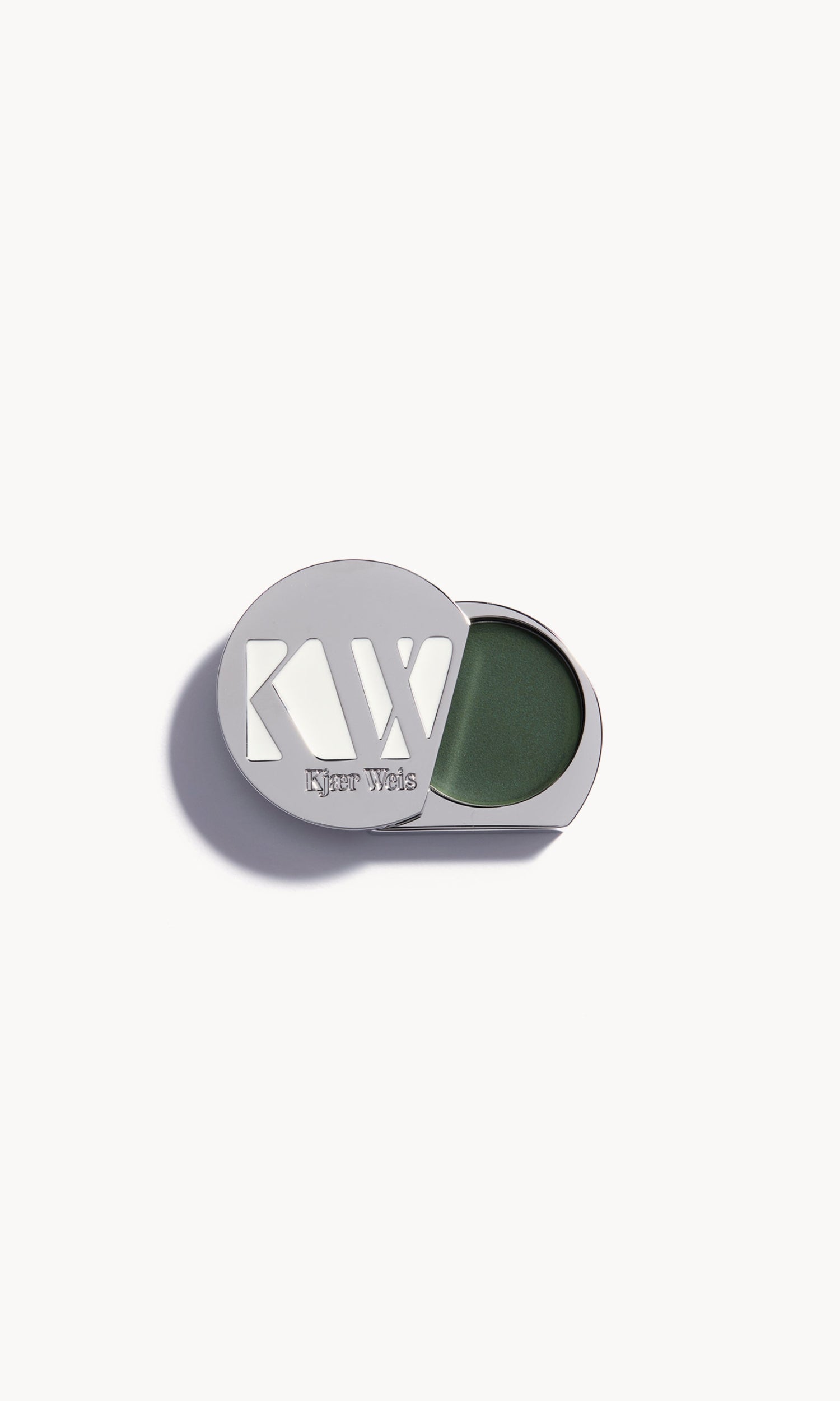 Solid metal palette with lid slid open to show cream eye shadow